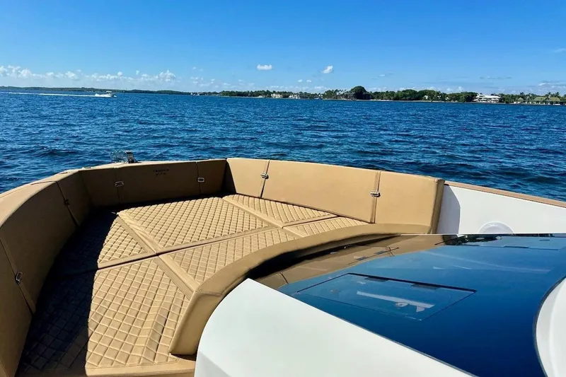 Slide: The Image of Luxurious 2023 Tesoro T38 boat with tan seating on a serene blue lake. - 43