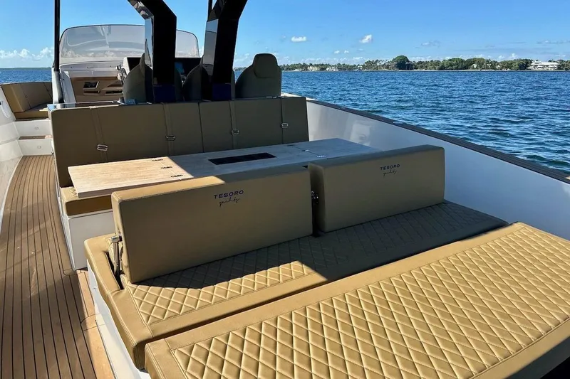 Slide: The Image of Luxurious 2023 Tesoro T38 yacht interior with elegant seating and scenic ocean view. - 44