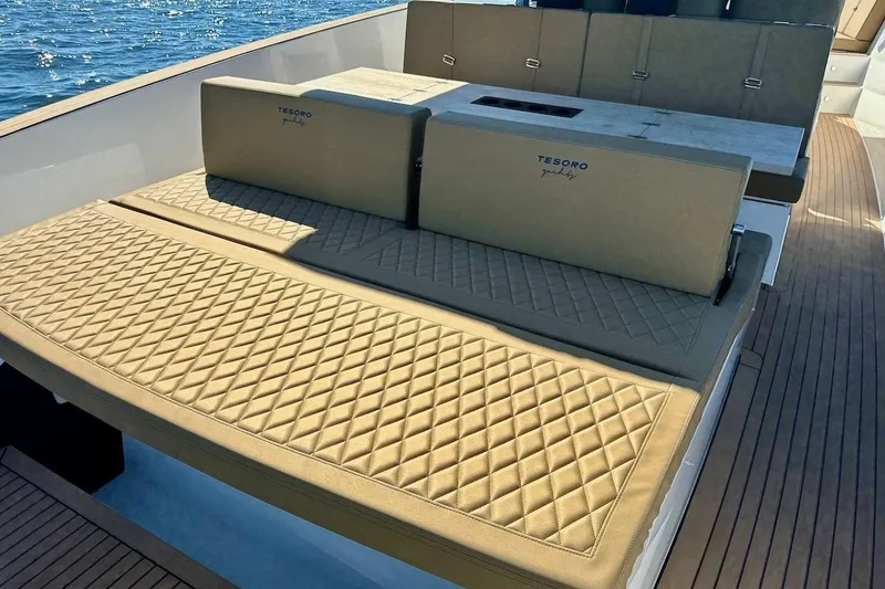 Slide: The Image of Luxurious seating on 2023 Tesoro T38 yacht with quilted cushions, ocean view. - 46