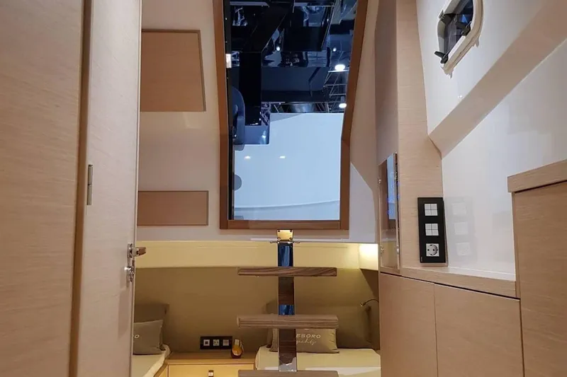 Slide: The Image of 2023 Tesoro T38 yacht interior with modern wood finish and sleek design elements. - 49