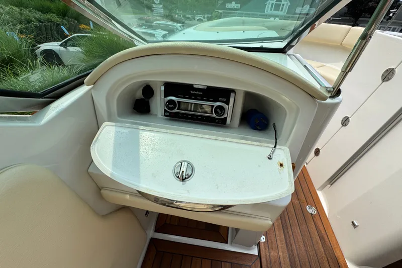 Slide: The Image of 2013 Chris-Craft Launch 28 interior with radio and wooden deck details. - 20