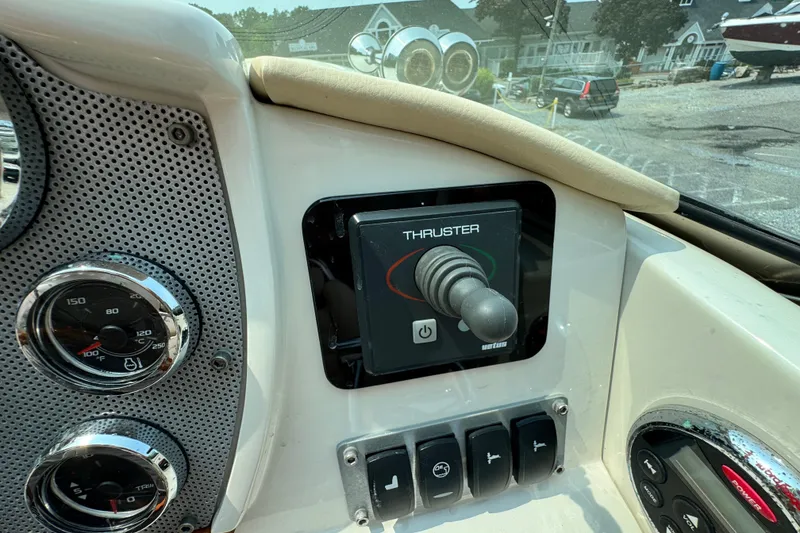 Slide: The Image of Control panel of a 2013 Chris-Craft Launch 28 boat with thruster joystick. - 14