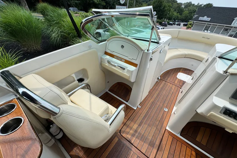 Slide: The Image of 2013 Chris-Craft Launch 28 interior with elegant seating and wooden flooring. - 19