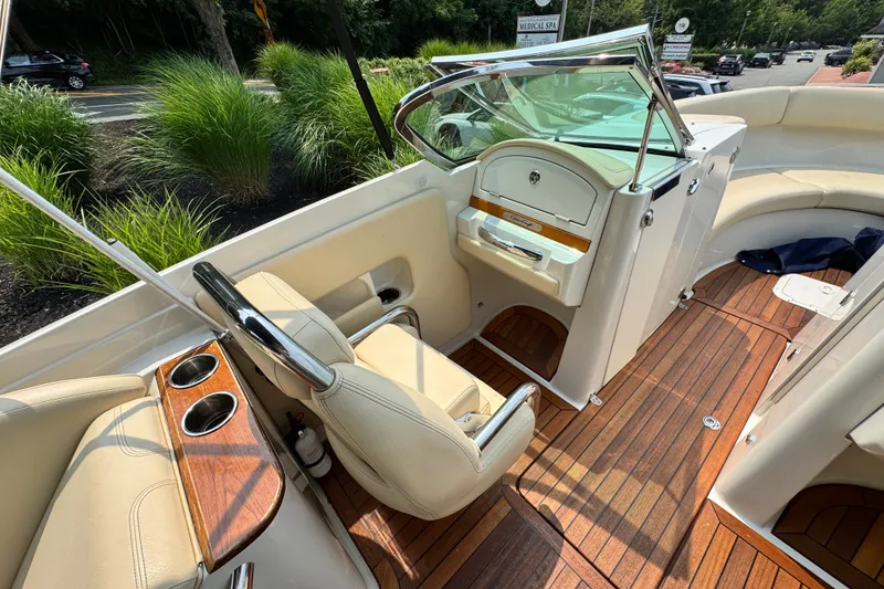 Slide: The Image of 2013 Chris-Craft Launch 28 interior with elegant seating and wooden flooring. - 10