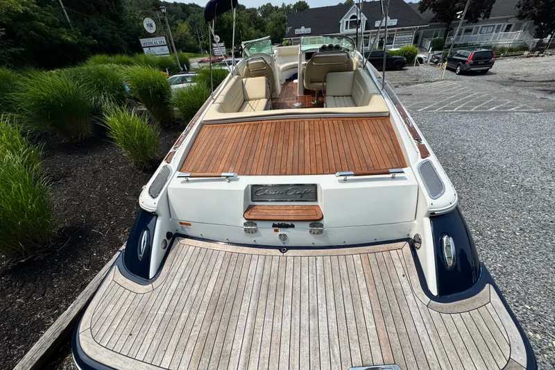 Slide: The Image of 2013 Chris-Craft Launch 28 boat with elegant wooden deck and luxurious seating. - 7
