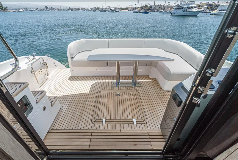 Slide: The Image of 2024 Azimut Fly 53 yacht deck with seating and ocean view. - 23