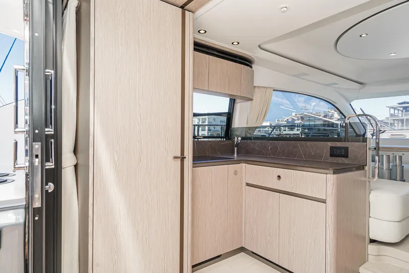Slide: The Image of Luxurious interior of 2024 Azimut Fly 53 yacht with modern kitchen design. - 29