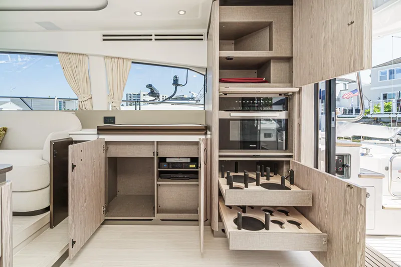 Slide: The Image of Modern kitchen interior of 2024 Azimut Fly 53 yacht with open cabinets and appliances. - 33