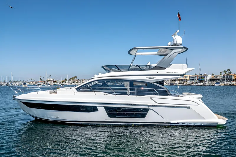 Slide: The Image of 2024 Azimut Fly 53 yacht on calm water, clear sky background. - 4