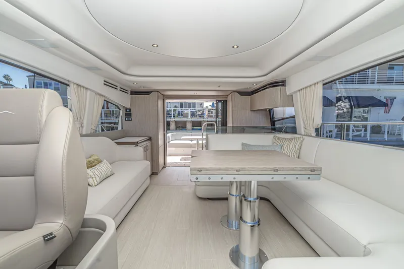 Slide: The Image of Luxurious interior of 2024 Azimut Fly 53 yacht with modern seating and dining area. - 40