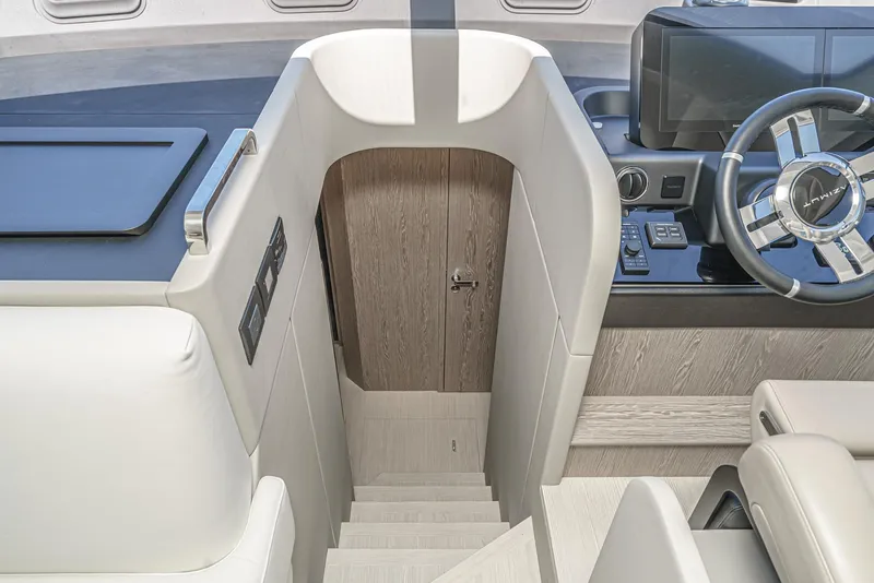 Slide: The Image of Interior of 2024 Azimut Fly 53 yacht, featuring modern helm and staircase. - 43