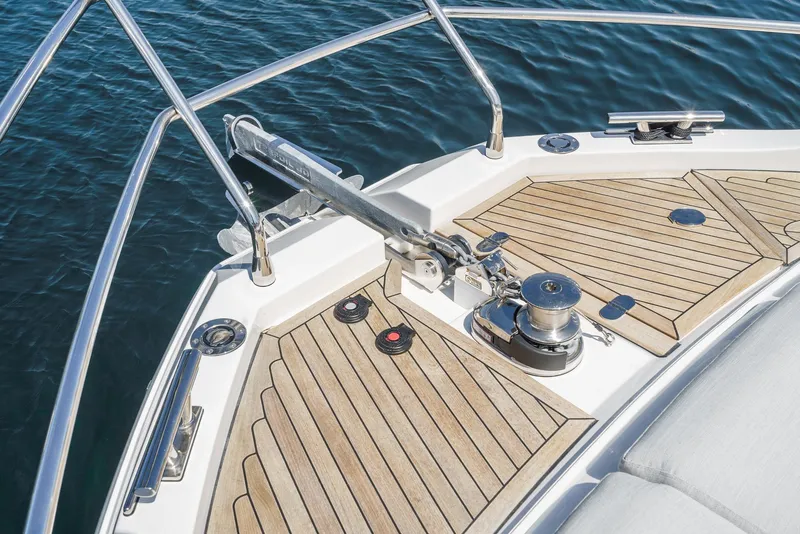 Slide: The Image of Azimut Fly 53 yacht bow with teak decking, 2024 model, on calm water. - 7