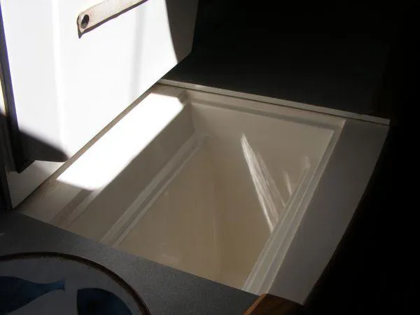 Slide: The Image of Open storage compartment in 2008 Seawind 1000 XL catamaran. - 10