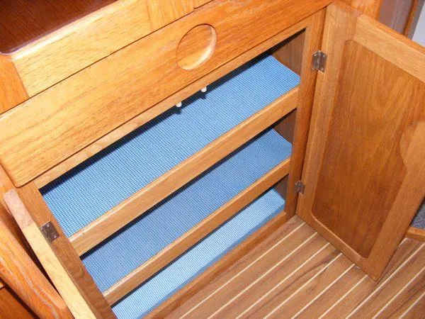 Slide: The Image of Wooden cabinet with blue shelves on Seawind 1000 XL, 2008 model. - 13