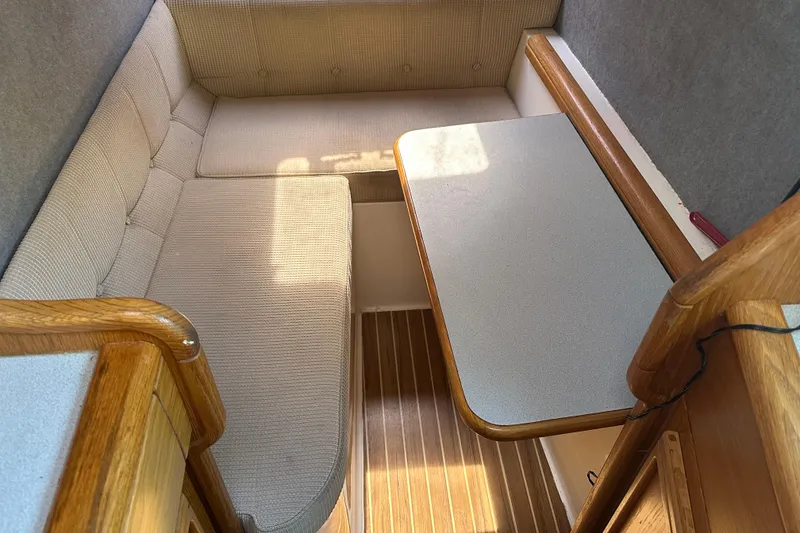 Slide: The Image of Cozy interior of 2008 Seawind 1000 XL catamaran with cushioned seating and wooden accents. - 17