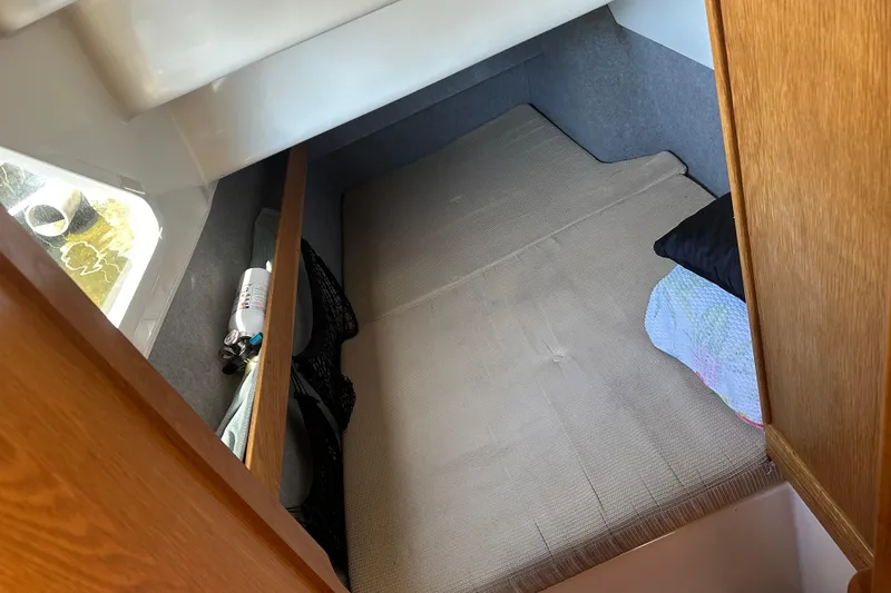 Slide: The Image of Interior cabin of 2008 Seawind 1000 XL catamaran, featuring a cozy sleeping area. - 18