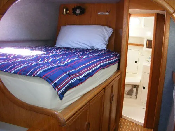 Slide: The Image of Interior of a 2008 Seawind 1000 XL yacht with cozy bed. - 21