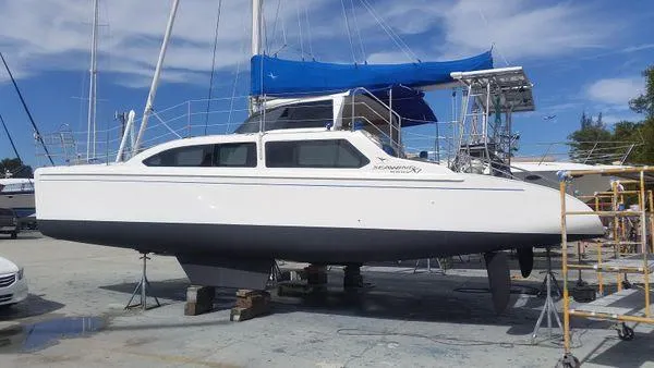 Slide: The Image of 2008 Seawind 1000 XL catamaran on dry dock. - 26