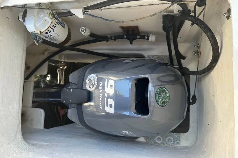 Slide: The Image of Outboard motor in a 2008 Seawind 1000 XL catamaran engine compartment. - 30
