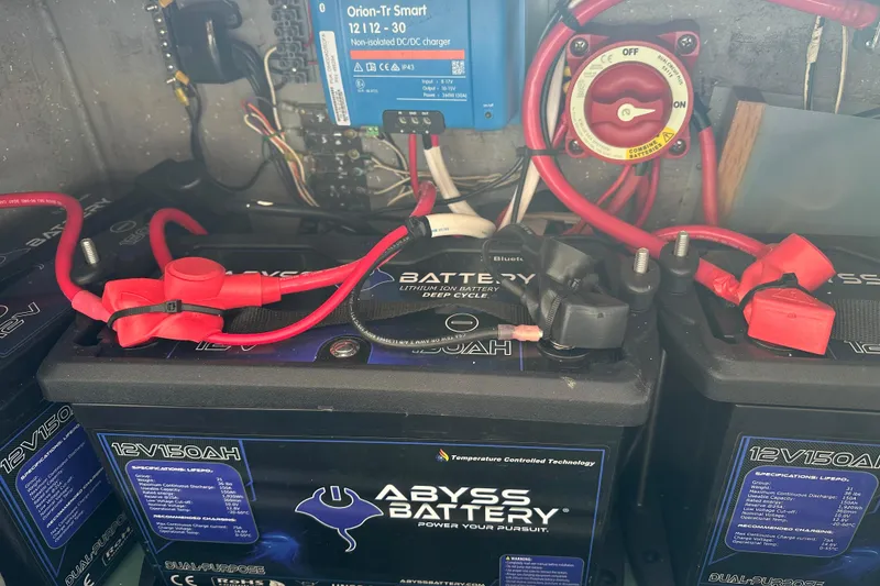 Slide: The Image of Battery setup in a 2008 Seawind 1000 XL, featuring Abyss lithium batteries and wiring components. - 33