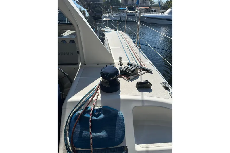 Slide: The Image of 2008 Seawind 1000 XL catamaran deck with ropes and winch, docked in marina. - 35