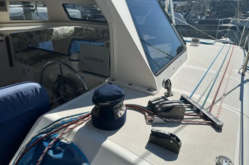 Slide: The Image of 2008 Seawind 1000 XL sailboat deck with ropes, winch, and Garmin navigation system. - 36