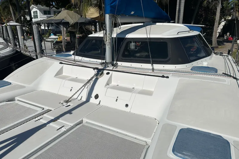 Slide: The Image of 2008 Seawind 1000 XL catamaran docked, showcasing deck and cabin features. - 42
