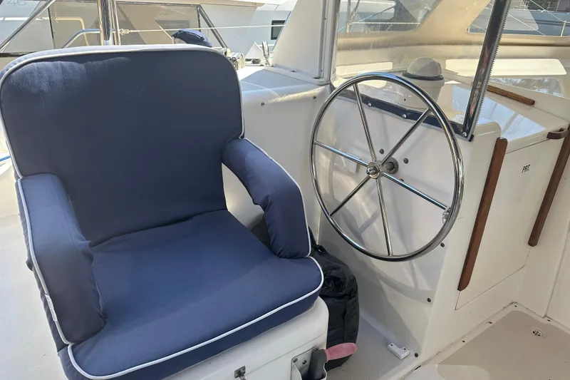 Slide: The Image of Captain's chair and steering wheel on 2008 Seawind 1000 XL catamaran. - 45