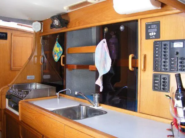 Slide: The Image of Interior of 2008 Seawind 1000 XL with kitchen and controls. - 6