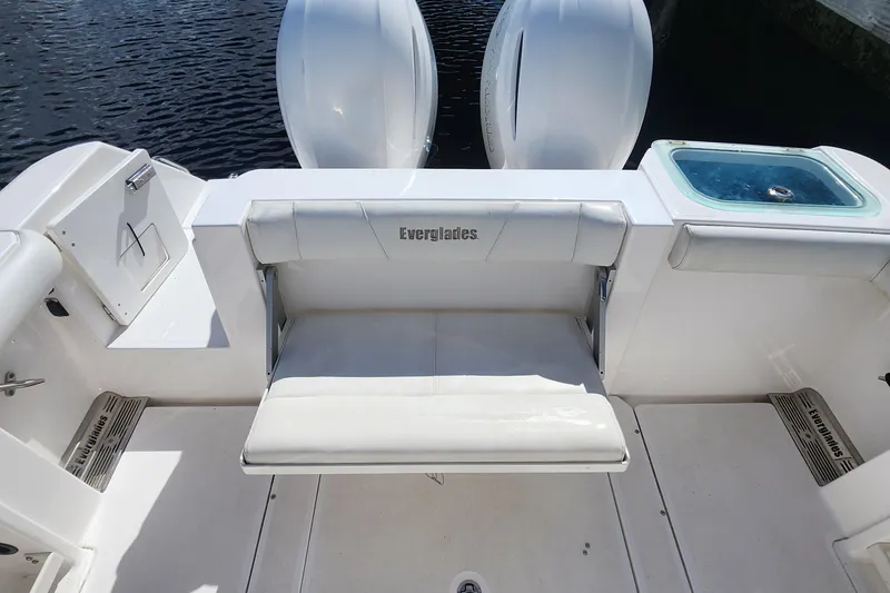 Slide: The Image of 2017 Everglades 255 Center Console boat interior with seating and storage compartments. - 16