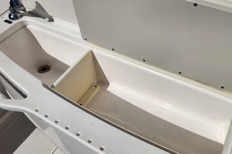 Slide: The Image of 2017 Everglades 255 Center Console boat sink and storage compartment. - 17