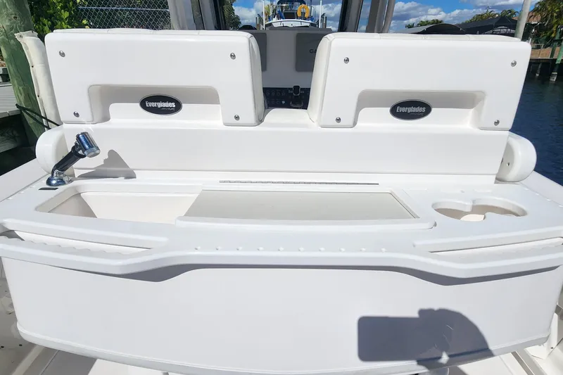 Slide: The Image of 2017 Everglades 255 Center Console boat interior with sink and storage compartments. - 18
