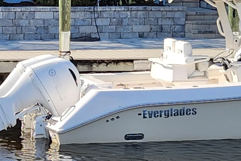 Slide: The Image of 2017 Everglades 255 Center Console boat docked with Yamaha outboard engine. - 4