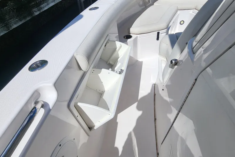 Slide: The Image of 2017 Everglades 255 Center Console boat interior with open storage compartment. - 40