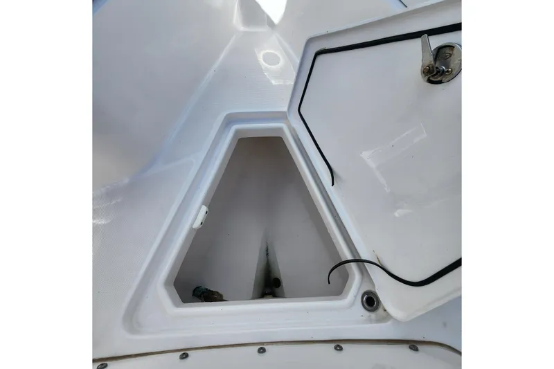 Slide: The Image of Open storage compartment on a 2017 Everglades 255 Center Console boat. - 41