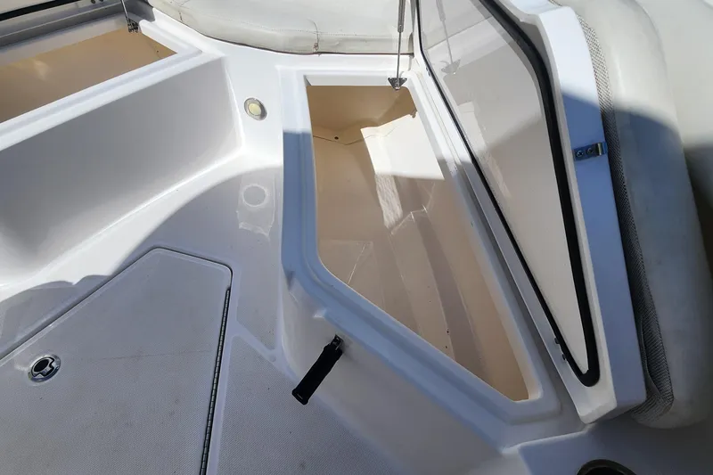 Slide: The Image of Open storage compartment on 2017 Everglades 255 Center Console boat. - 43