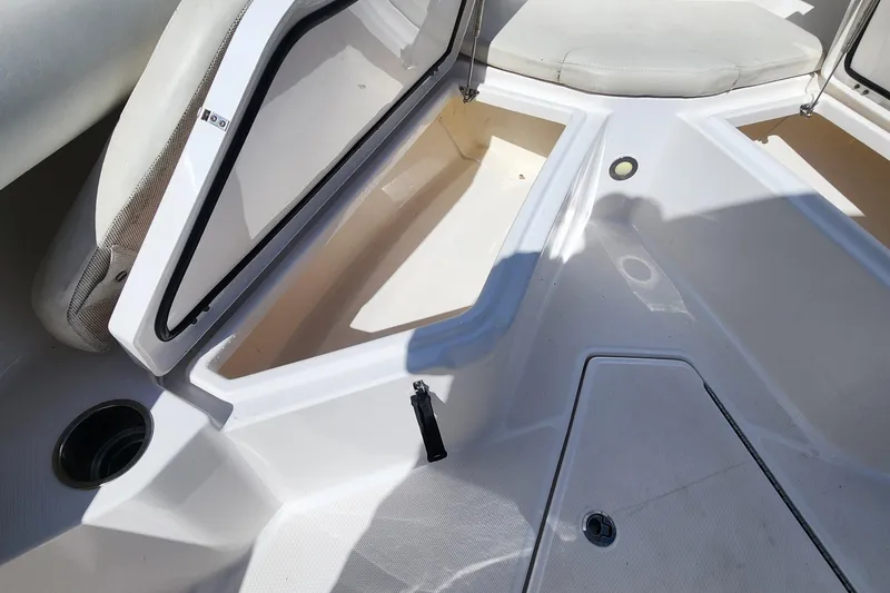 Slide: The Image of 2017 Everglades 255 Center Console boat with open storage compartments. - 44