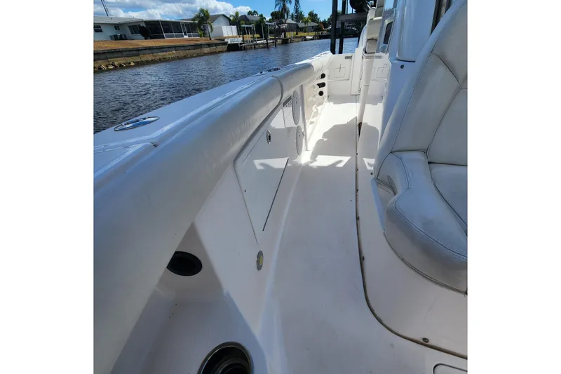 Slide: The Image of 2017 Everglades 255 Center Console boat interior with seating and water view. - 45