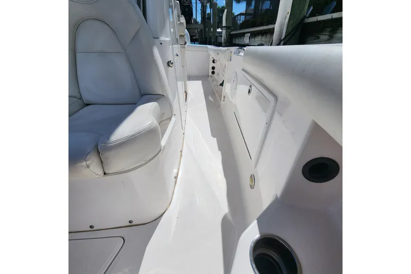 Slide: The Image of 2017 Everglades 255 Center Console boat interior with white seating and storage compartments. - 46