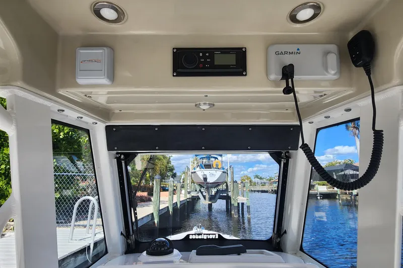 Slide: The Image of Interior view of 2017 Everglades 255 Center Console boat with Garmin equipment. - 50