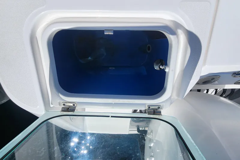 Slide: The Image of Open storage compartment on a 2017 Everglades 255 Center Console boat. - 53