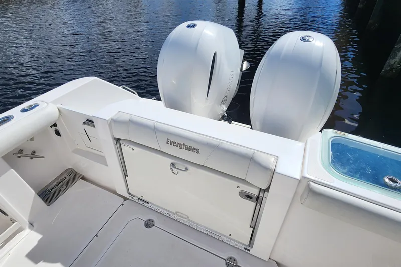 Slide: The Image of 2017 Everglades 255 Center Console boat with dual engines on calm water. - 54