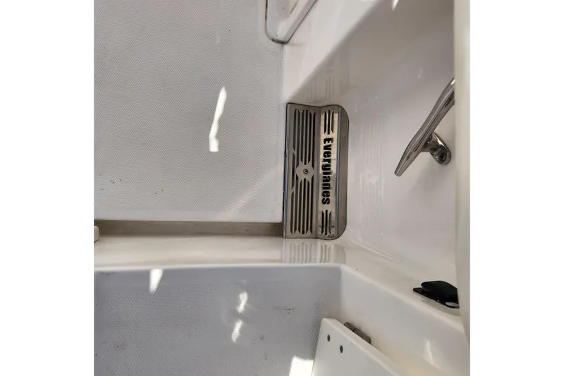 Slide: The Image of 2017 Everglades 255 Center Console boat interior with branded metal drain cover. - 57