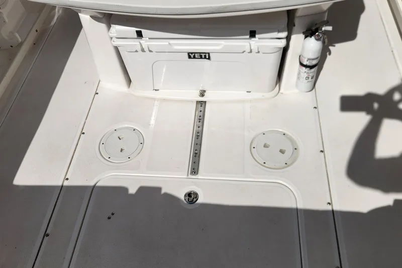 Slide: The Image of 2017 Everglades 255 Center Console deck with Yeti cooler and fire extinguisher. - 58