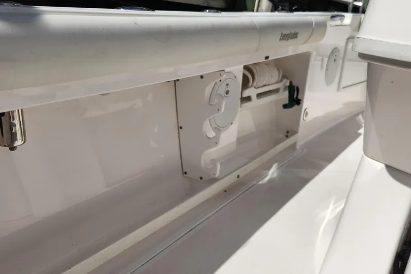 Slide: The Image of 2017 Everglades 255 Center Console boat interior detail, featuring storage compartment and clean design. - 59