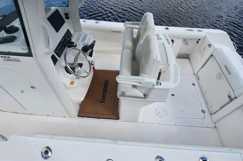Slide: The Image of 2017 Everglades 255 Center Console boat interior with steering wheel and seating. - 7