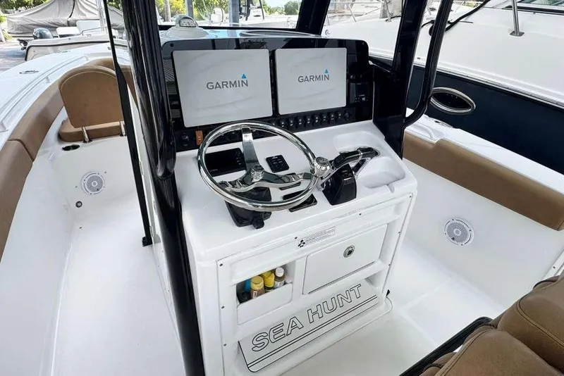 Slide: The Image of 2020 Sea Hunt Gamefish 27 helm with dual Garmin displays and forward seating. - 10