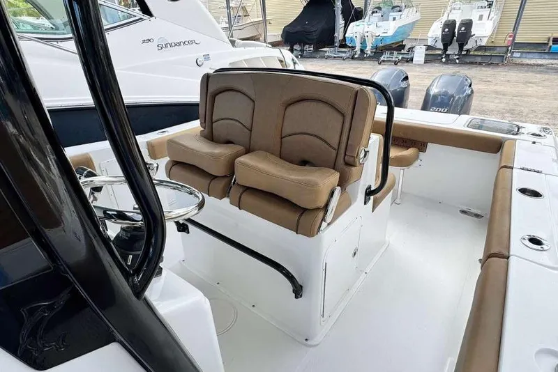 Slide: The Image of 2020 Sea Hunt Gamefish 27 boat interior with forward seating and dual engines. - 11
