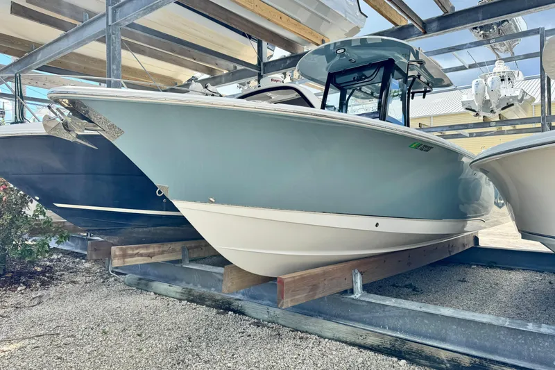 Slide: The Image of 2020 Sea Hunt Gamefish 27 Forward Seating boat in storage, side view. - 4