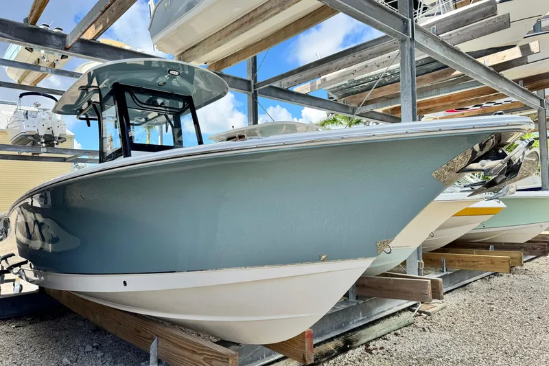 Slide: The Image of 2020 Sea Hunt Gamefish 27 Forward Seating boat in storage, side view. - 5